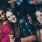 three young women dressed up and having drinks at local bar